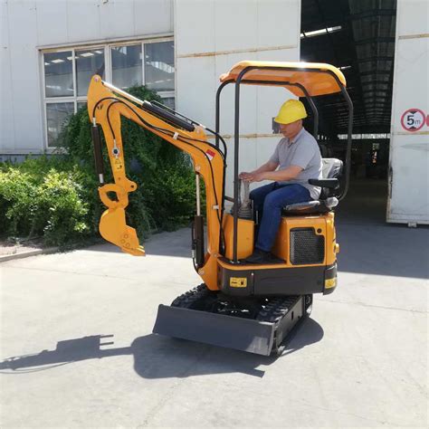 1-ton mini excavator carrying a tree|mini excavator push over tree.